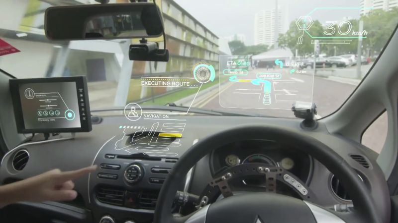 Still from a promotional video for the Smart Nation featuring a Self-Driving Vehicle.
Source: (link: Still from a promotional video for the Smart Nation featuring a Self-Driving Vehicle. Source: https://www.youtube.com/watch?v=zLalLfe03SY. text: https://www.youtube.com/watch?v=zLalLfe03SY.)